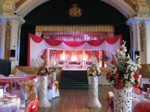 White asian wedding stage with red draping | Simplicity events | Asian Weddings