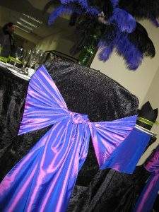 Black chair cover with purple bow | Simplicity events | Asian Weddings