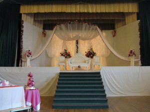 White asian wedding stage with floral decor | Simplicity events | Asian Weddings