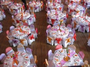 Wedding table decor with multi coloured chair sash | Simplicity events | Asian Weddings