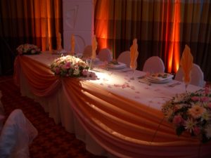 Pink draped top table decor with floral centerpieces | Simplicity events | Asian Weddings