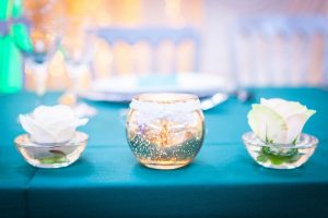 White rose and gold candle holder wedding decor at Devonshire Dome | Simplicity events | Asian Weddings