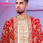 Asian Wedding Experience Catwalk | Groom in gold and red asian sherwani